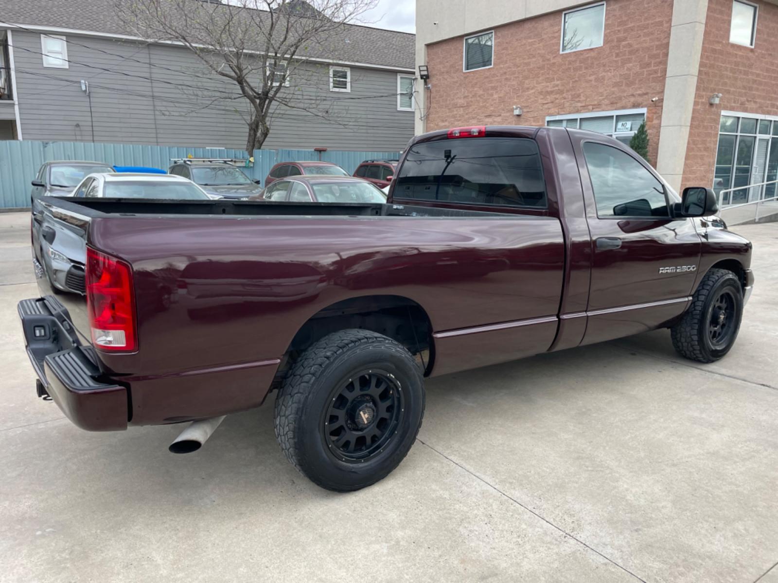 2004 Maroon /Black Dodge Ram 2500 Laramie 2WD (3D7KA26C44G) with an 5.9L L6 OHV 24V TURBO DIESEL engine, Automatic transmission, located at 1501 West 15th St., Houston, 77008, (713) 869-2925, 29.797941, -95.411789 - Photo #2